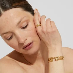 Liane crossed bangle bracelet mini gold